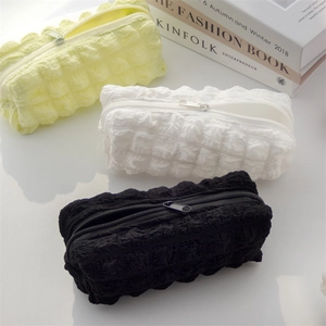 Minimalist bubble puff stationery pouch in soft cream colors with 3D texture and zipper