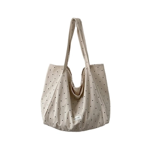 Minimalist polka dot canvas tote bag with large capacity and shoulder straps in oatmeal