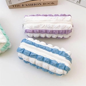 Detailed view of bubble texture pencil cases in purple blue and green pastel colors