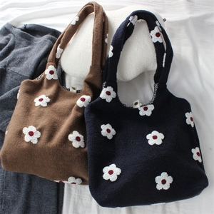 Navy and brown woolen tote bags with daisy embroidery and checkered lining details