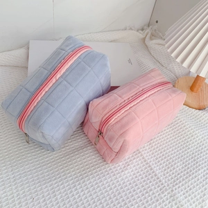 Quilted velvet pencil case and cosmetic bag in pastel pink and light blue colors