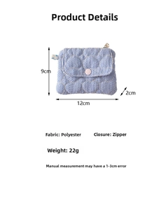 Blue quilted heart coin purse with zipper and pink button front pocket detail