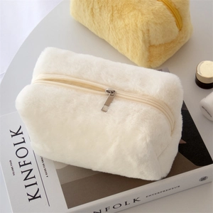 Plush macaron makeup bag and portable pencil case in soft faux fur with top zipper