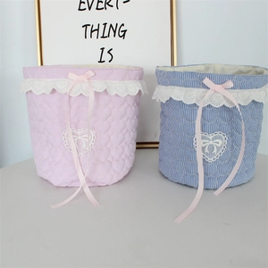 Pink and blue sweet lace fabric storage baskets with bow details and quilted stripe texture