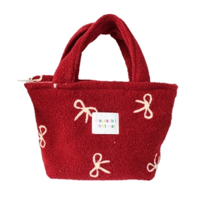 Sac fourre-tout rouge en peluche avec broderie de nœuds blancs et poignée supérieure