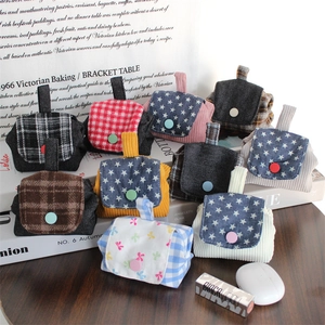 Mini corduroy coin purses and earphone storage bags in various colors and patterns