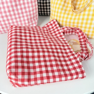 Gingham pattern canvas tote bags in red, yellow, pink, and black colors displayed together