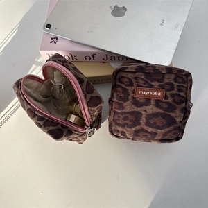 Set of two leopard print suede makeup pouches with secure zipper and leather logo