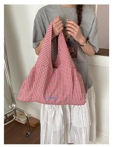 Detail of red and white checkered tote bag with blue GoodThing embroidery detail