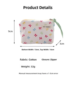 Detailed size parameters of mini bow print cotton pouch with green strap and zipper