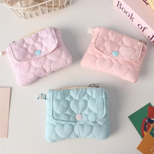 Quilted heart coin purses in pink and blue with snap closure for small item storage