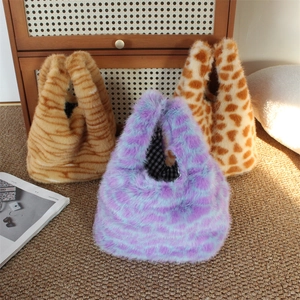 Detailed plush faux fur handbags in trendy purple spots, tiger stripes, and leopard prints