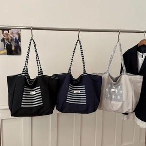Striped canvas tote bags in black, blue and grey with wide straps and high capacity