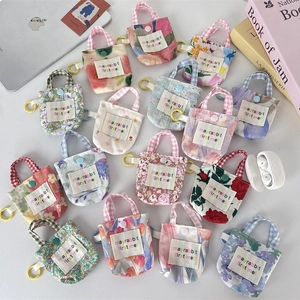 Mini pochette écouteurs en toile florale avec poignée supérieure et fermeture à bouton
