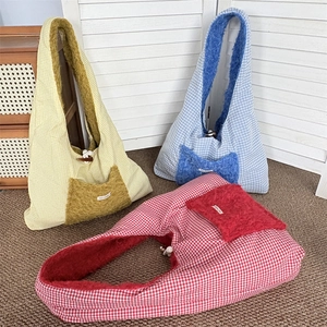 Close-up of three checkered tote bags with plush trim and wooden toggle closure details
