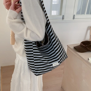 Large striped canvas tote bag with adjustable strap for casual daily commuting use