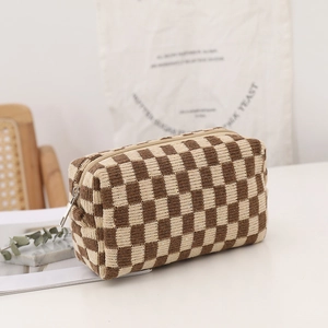 Knitted checkerboard makeup bag in brown and beige with sturdy silver metal zipper