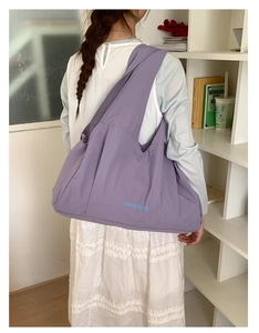 Detailed back view of large purple tote bag with GoodThing print and wide strap