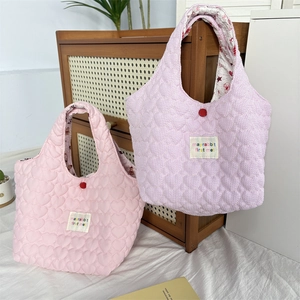 Chic quilted heart tote bags in pink and purple with soft fabric and letter label