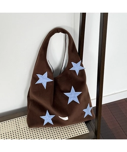 Brown velvet hobo shoulder bag featuring five light blue star patches and wide strap detail