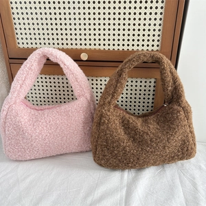 Fuzzy faux fur handbags in pink and brown with metallic zippers for autumn and winter