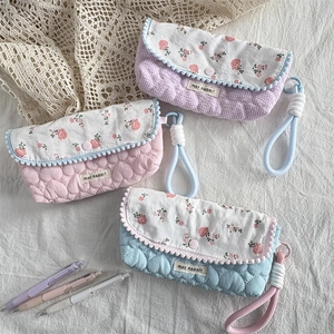 Quilted floral pencil cases in purple pink and blue with braided wrist straps