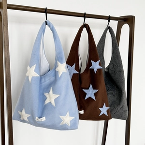 Three plush wool shoulder bags in blue, brown and grey with star patches and large capacity