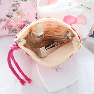 Close-up of floral drawstring pouches for makeup storage and small accessories