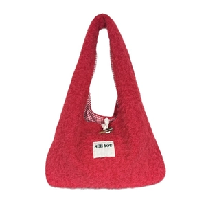 Winter red plush shoulder bag with toggle closure and SEE YOU patch in a minimalist style