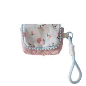Floral padded camera and earphone case with light blue lanyard and quilted pink fabric