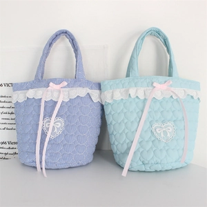 Quilted light blue heart bucket bag with lace edges and pink bows in a sweet style