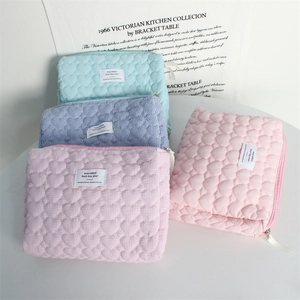 Quilted heart pattern toiletry bags in light blue and pink with zipper closure