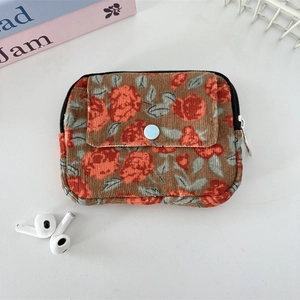 Macro detail of floral corduroy fabric texture and functional front button pocket