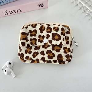 Close-up of leopard print corduroy pouch with zipper ring and snap button pocket