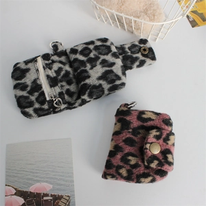 Detail of leopard print plush coin purses with heart zipper and snap closure