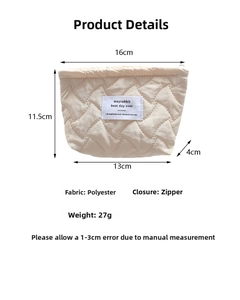 Detailed size chart for the quilted vertical stripe makeup bag in cream polyester