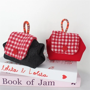 Mini denim and red canvas coin purses with tweed flaps and colorful woven handles