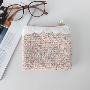 Pink tweed coin purse with white lace trim and a large pearl zipper charm detail