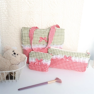 Detailed set of red and green plaid bags with lace trim and bowknot accents