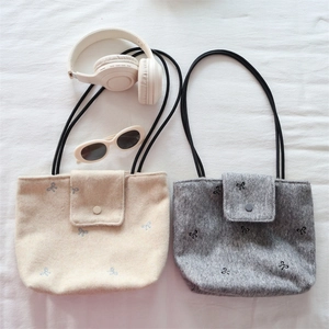 Bow embroidery canvas tote bag in beige and grey with slim black shoulder straps