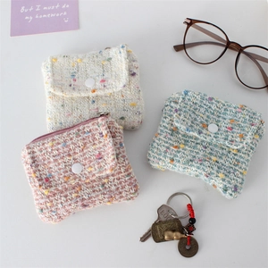 Chic tweed coin purses in pink, blue, and white with woven texture and button closures