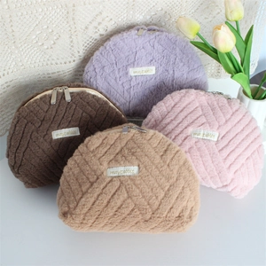 Detailed plush quilted shell cosmetic bags in purple, coffee, pink, and khaki colors