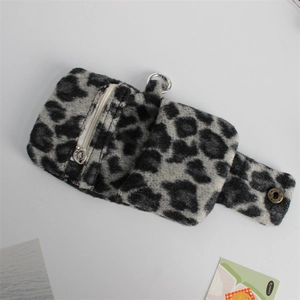 Close-up of leopard print plush coin purse featuring a heart zipper and metal buckle clip