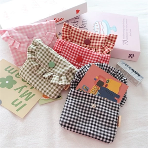 Mini plaid pouches with ruffle edges and button closures in multiple colors for girls