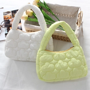 Quilted mini cloud tote bags in pearl white and mint green for a soft, trendy fashion style