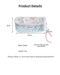 Detailed size view of quilted heart pattern floral pouch with pink floral flap and dimensions