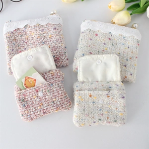 Exquisite tweed mini coin purse with white lace trim and elegant pearl zipper pull