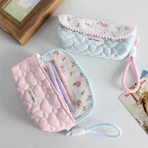 Quilted floral pencil case with heart texture and portable handle for stationery storage