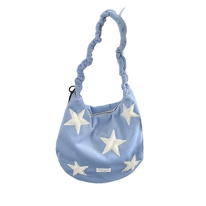 Light blue faux fur star pattern tote bag with pleated shoulder strap and brand label