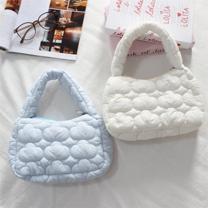 Quilted mini cloud handbag in light blue and beige with soft padded nylon texture
